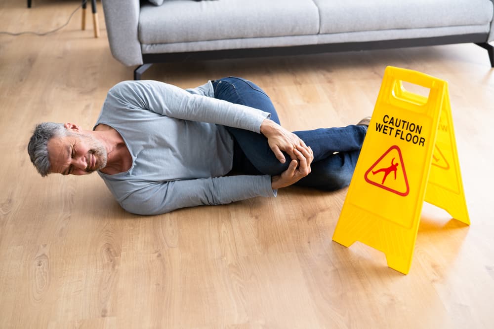 Image of a cautionary floor sign indicating slip and fall risk, promoting safety awareness.