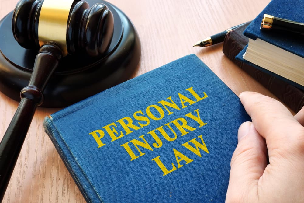 Personal injury law and gavel on a desk.