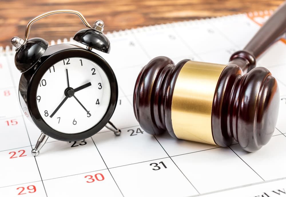 A clock and gavel on the calendar 