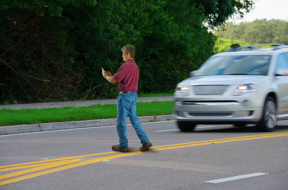 Car is about to hit a pedestrian on the road