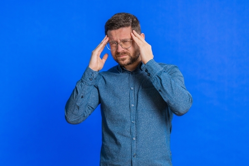 Traumatic Brain Injury Claim Florida attorney illustrated with a man experiencing head pain, showing common signs that may support a traumatic brain injury claim.