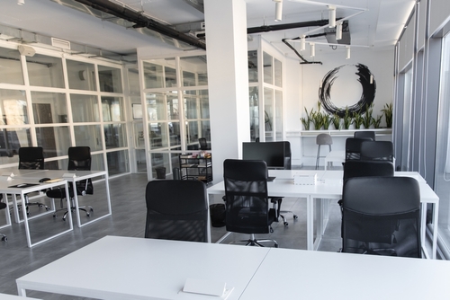 Modern office interior with glass walls and desks, representing consultation space for a Gainesville Premises Liability Lawyer.