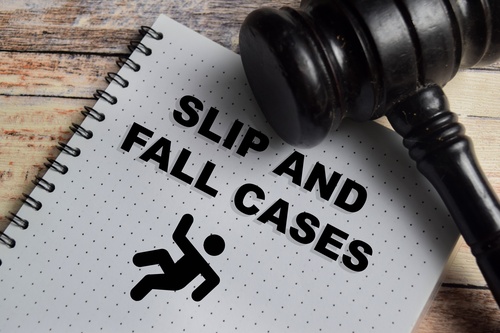 Gavel resting on notebook labeled slip and fall cases, symbolizing representation by a Gainesville Slip and Fall Accident Lawyer.
