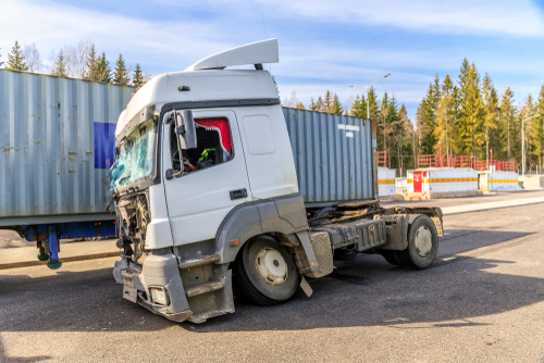 Jackknife truck accidents in Gainesville showing a damaged semi-truck cab after a collision with a trailer.