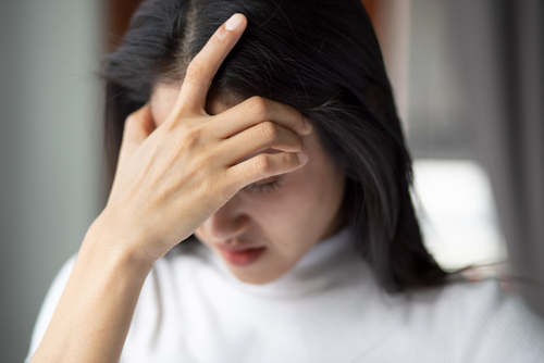 Gainesville brain injury lawyer showing a person experiencing symptoms after a head injury.