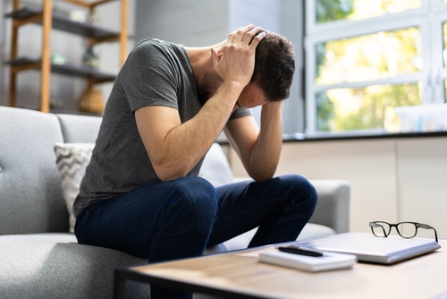 Gainesville brain injury lawyer showing a person experiencing symptoms after a traumatic brain injury.