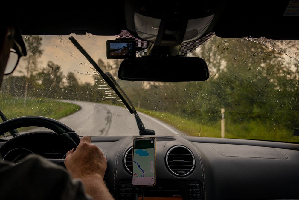Gainesville car accident lawyer explains how rain and weather conditions reduce visibility while driving on a wet and winding road.