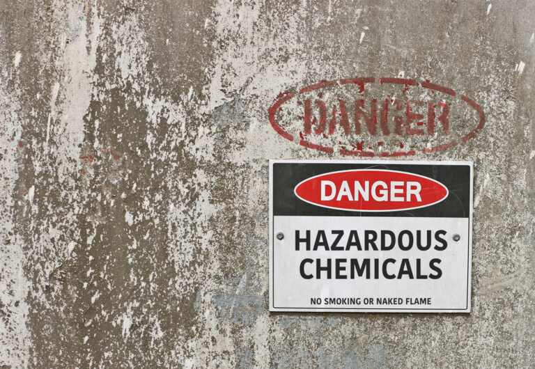 red, black and white Danger, Hazardous Chemicals warning sign