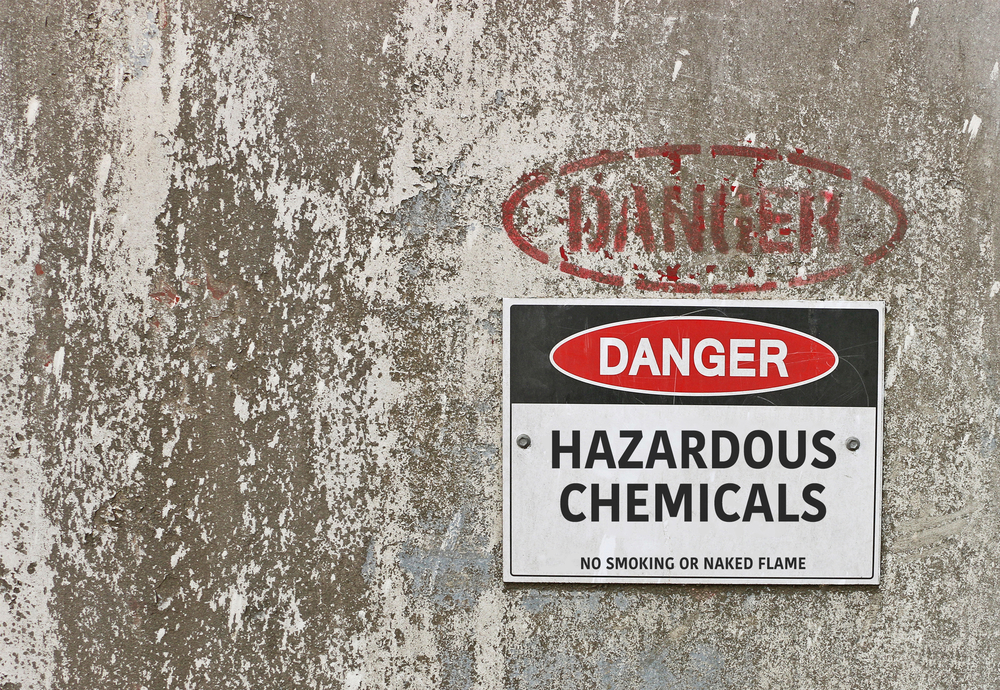 red, black and white Danger, Hazardous Chemicals warning sign