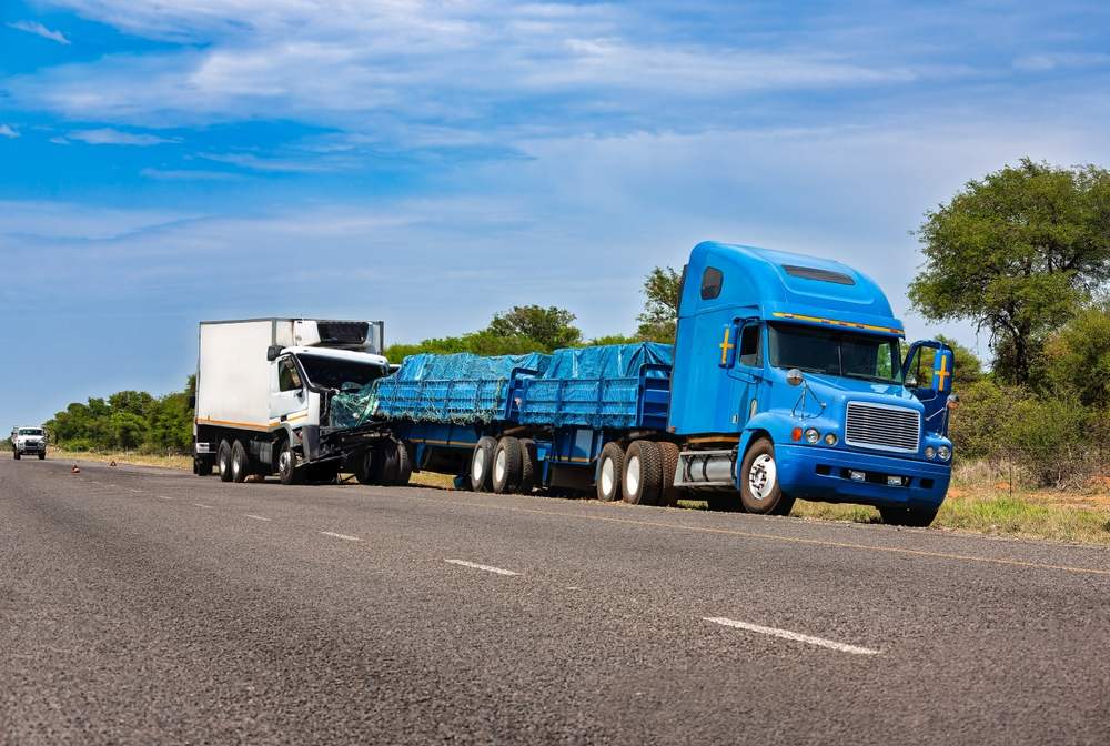 Semi-truck collision with a commercial box truck on the highway near Tioga Gainesville