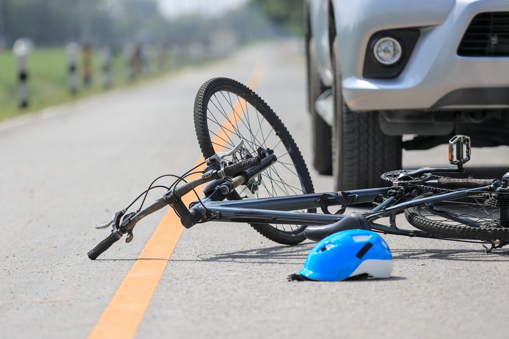 Bicycle and helmet on the road after a bicycle accident near the SR-200 corridor in Ocala