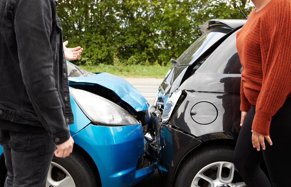 Drivers assessing damage after a car accident in Gainesville, FL