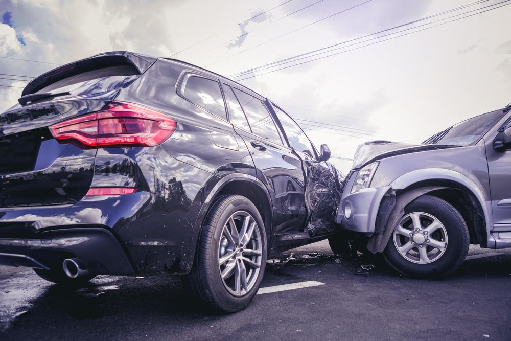 Side-impact collision damage to the front passenger door of an SUV after a Haile Plantation car accident in Gainesville