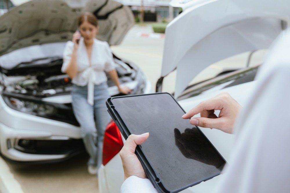 Driver calling her insurer after a car accident in Florida