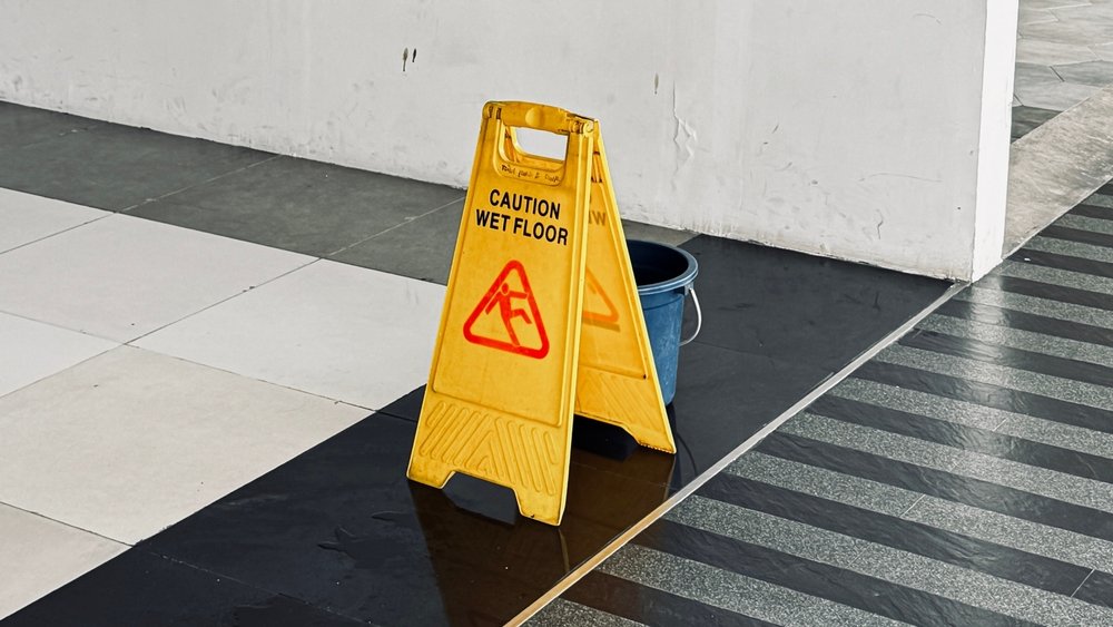 Wet floor caution sign warning of slip and fall hazard indoor in Ocala