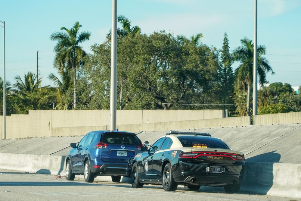 Highway Patrol pulling over car on Florida Insterstate.